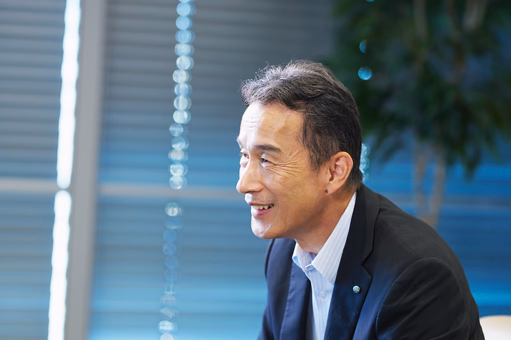 Profile view of Mr. Minakata speaking