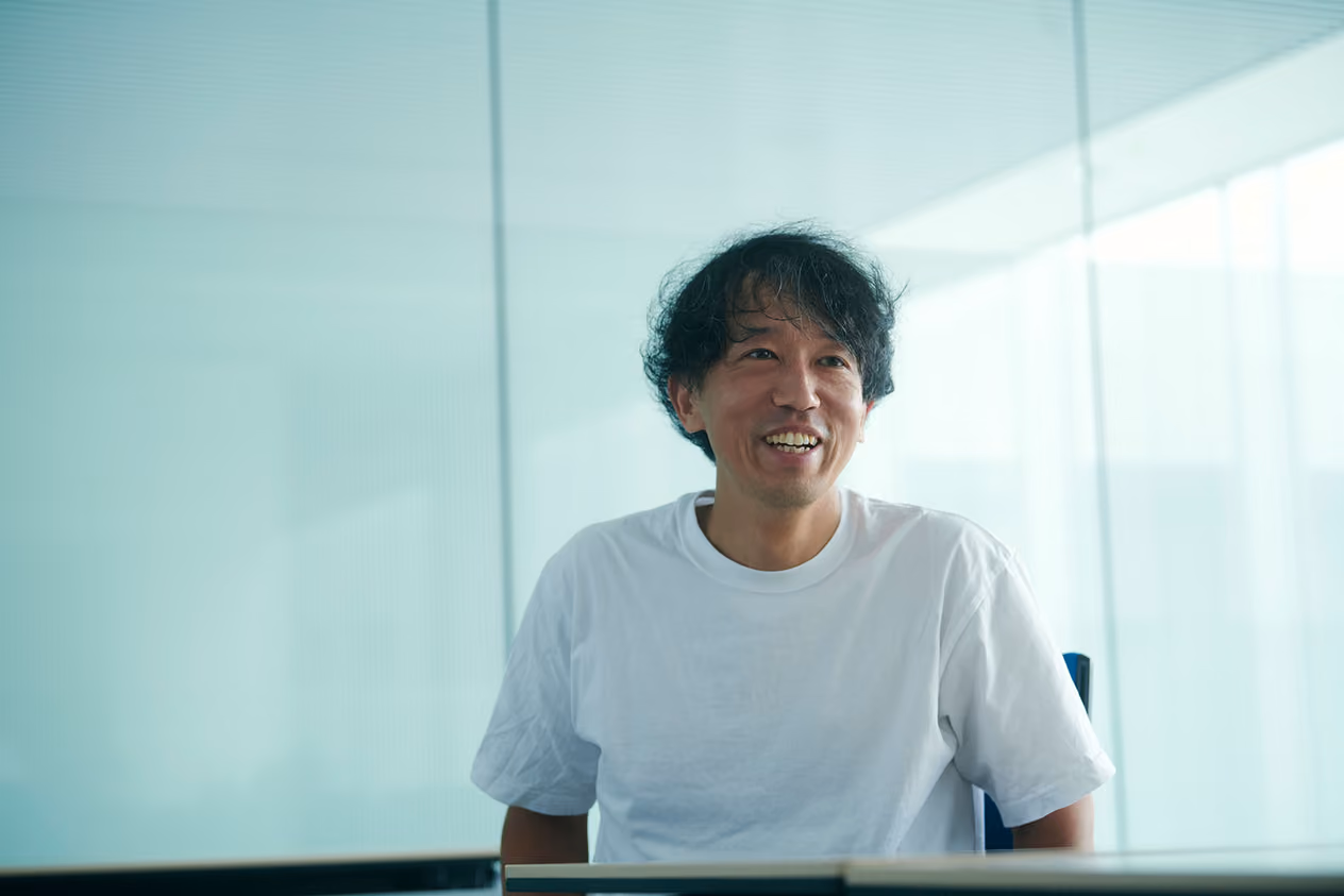 Kenta Jonai speaking with a smile