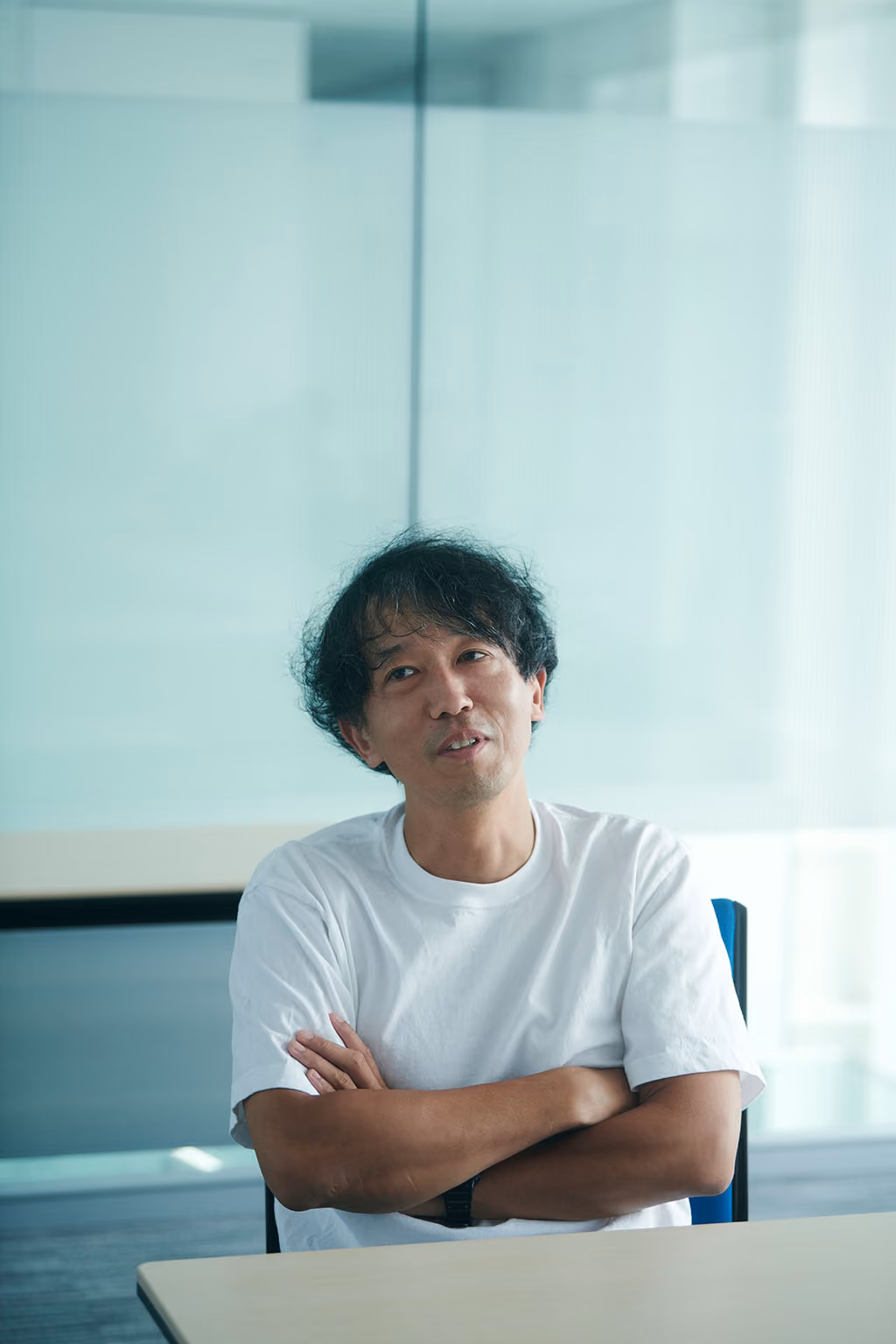 Kenta Jonai speaking with his arms crossed