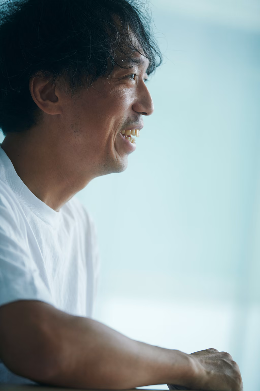 Kenta Jonai speaking with a smile