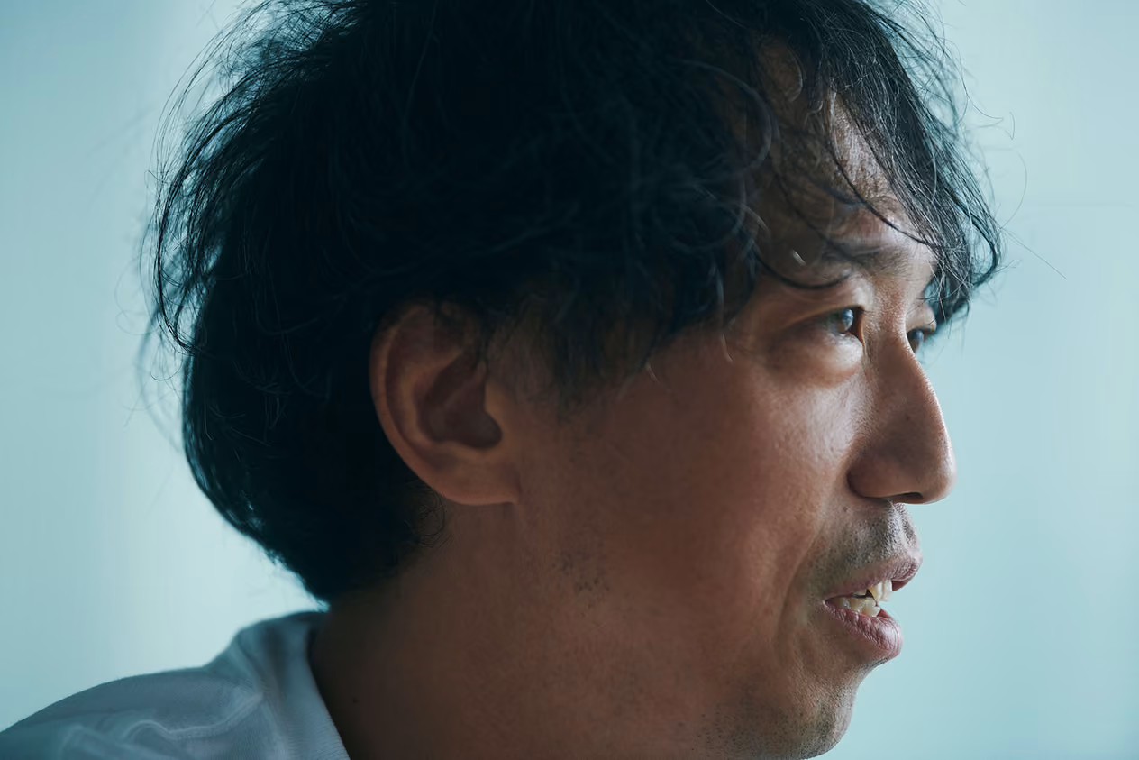 A profile shot of Kenta Jonai discussing research