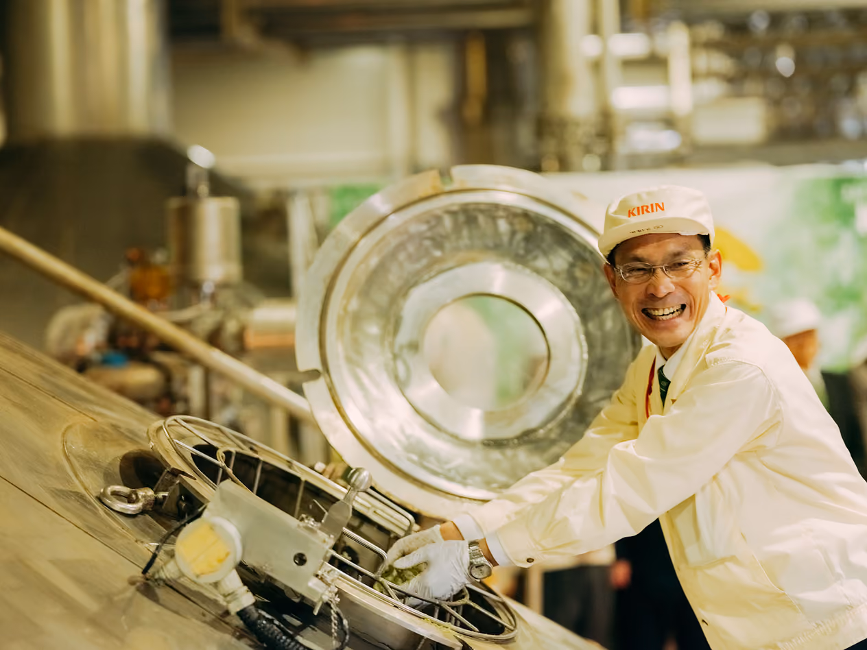 Plant Manager Kubota adding frozen hops to the brewing kettle for KIRIN ICHIBAN TORETATE HOP