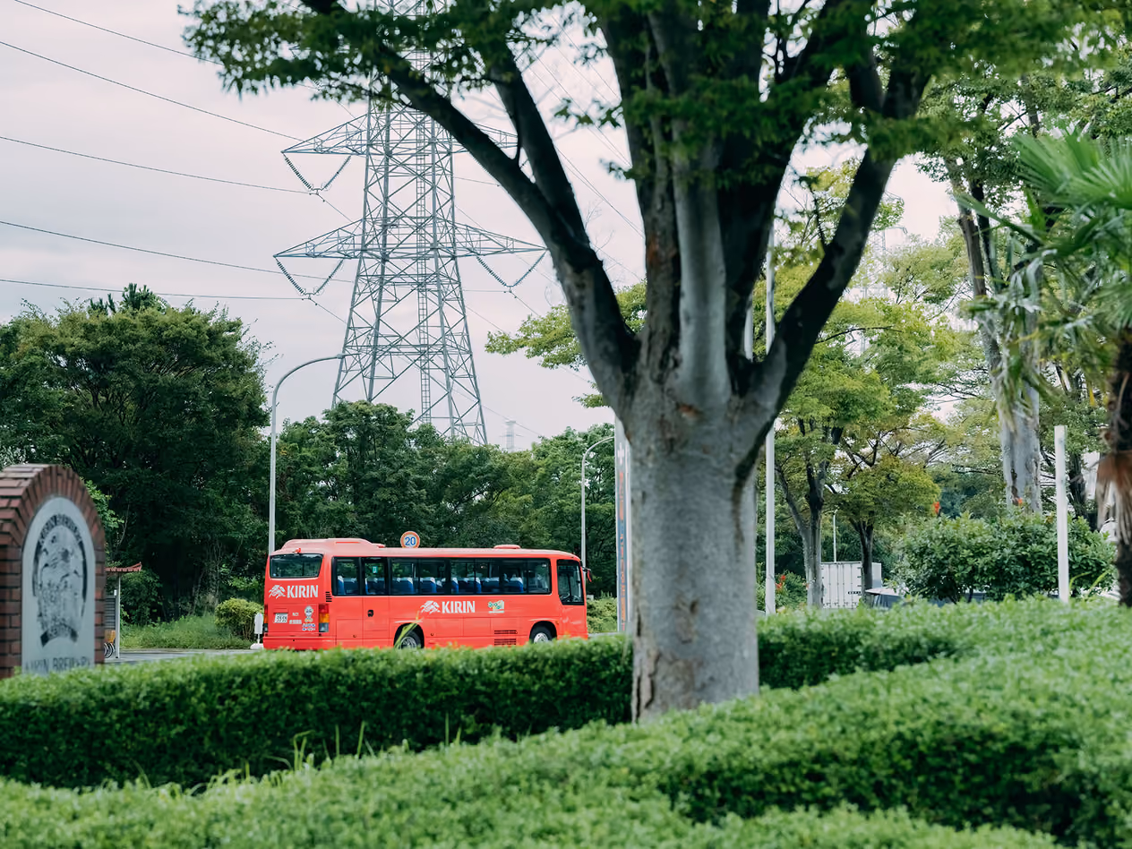 A Kirin-branded bus driving through the Kirin Brewery Sendai Plant grounds